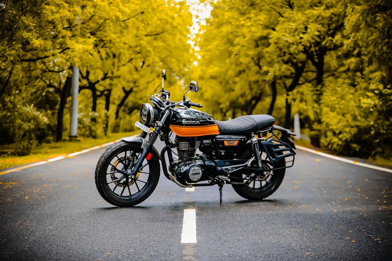 Black Motorcycle Parked on Gray Concrete Road